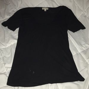 Thin T with cross detail on neck.